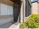 Charming front entrance with screened door, complemented by lush, green landscaping at 10265 Gandy N Blvd # 1203, St Petersburg, FL 33702