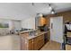 Eat-in kitchen featuring stainless steel appliances, double sink and light brown cabinetry at 10265 Gandy N Blvd # 1203, St Petersburg, FL 33702