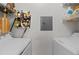 Functional laundry area features white appliances, shelving, and essential household supplies at 10265 Gandy N Blvd # 1203, St Petersburg, FL 33702
