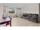 Bright living room featuring new flooring, a large window for natural light, and ample space for Gathering relaxation at 10265 Gandy N Blvd # 1203, St Petersburg, FL 33702