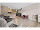 Spacious living room with plank floors, neutral paint, and open layout to kitchen and dining areas for modern living at 10265 Gandy N Blvd # 1203, St Petersburg, FL 33702