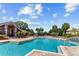 Resort-style pool area with ample seating and lush greenery, perfect for relaxation at 10265 Gandy N Blvd # 1203, St Petersburg, FL 33702