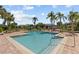 A refreshing community pool surrounded by lush landscaping and lounge chairs offers an ideal spot for relaxation at 10265 Gandy N Blvd # 1203, St Petersburg, FL 33702