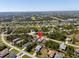 A wide aerial view features the home and the many other homes surrounding it at 109 Beau Rivage Dr, Rotonda West, FL 33947
