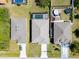 Aerial view of the property with a screened pool and well-maintained yard at 109 Beau Rivage Dr, Rotonda West, FL 33947