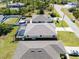 A high-angle view showcases the backyard with the neighboring houses nearby at 109 Beau Rivage Dr, Rotonda West, FL 33947