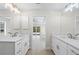 Luxurious bathroom with dual sinks and a bright natural light at 109 Beau Rivage Dr, Rotonda West, FL 33947