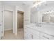 A luxurious bathroom featuring tile shower and large vanity at 109 Beau Rivage Dr, Rotonda West, FL 33947