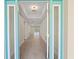Bright foyer view showcasing tile flooring and a glimpse of the living area and pool at 109 Beau Rivage Dr, Rotonda West, FL 33947