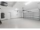The oversized garage is painted white and has a door leading outside at 109 Beau Rivage Dr, Rotonda West, FL 33947