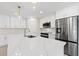 Modern kitchen with stainless steel appliances, center island, and white cabinetry at 109 Beau Rivage Dr, Rotonda West, FL 33947