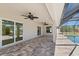 Covered patio with sliding glass door provides seamless indoor-outdoor living at 109 Beau Rivage Dr, Rotonda West, FL 33947