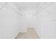 Empty walk-in closet with tile floors and wire rack shelving for easy storage at 109 Beau Rivage Dr, Rotonda West, FL 33947