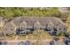 Eye-level view of a two-story apartment building with multiple units, parking, sidewalks, and green landscaping at 12960 Trade Port Pl, Riverview, FL 33579