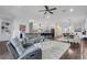 Bright and airy living room with a large rug and open floor plan at 14013 Kingfisher Glen Dr, Lithia, FL 33547