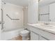 Clean bathroom with accessible handrails, tiled walls, and a modern vanity at 14211 Shadow Moss Ln # 101, Tampa, FL 33613