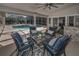 Outdoor patio with a covered seating area and a view of the pool and spa at 1681 Sparkling Ct, Dunedin, FL 34698