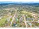 Wide aerial view of neighborhood featuring tree-lined streets and well-maintained homes, some with private pools and spacious yards at 1710 Orange Hill Way, Brandon, FL 33510
