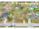 Aerial view of the property and the neighborhood with many lush trees at 1710 Orange Hill Way, Brandon, FL 33510