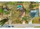 Overhead view of the property showcasing the home, swimming pool, and surrounding neighborhood at 1710 Orange Hill Way, Brandon, FL 33510