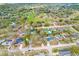 Community aerial view showcasing lush landscape, houses, neighborhood park and lake at 1710 Orange Hill Way, Brandon, FL 33510