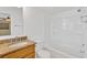 Bathroom featuring a shower and tub combo, and a wooden vanity with stone countertop at 1710 Orange Hill Way, Brandon, FL 33510
