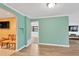 Open dining room with wood floors and archway views to the living and Gathering rooms at 1710 Orange Hill Way, Brandon, FL 33510