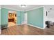 Dining room featuring wood floors and views into the wet bar and other rooms at 1710 Orange Hill Way, Brandon, FL 33510