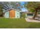 Charming home with a well-maintained lawn and unique wooden accent, enhanced by mature trees providing shade at 1710 Orange Hill Way, Brandon, FL 33510