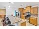 Spacious kitchen with oak cabinets, granite counters, stainless steel appliances and seating at the breakfast bar at 1710 Orange Hill Way, Brandon, FL 33510