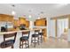 Kitchen featuring oak cabinets, granite counters, stainless appliances and a breakfast bar with stool seating at 1710 Orange Hill Way, Brandon, FL 33510