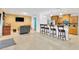 Open floor plan featuring living room and kitchen with breakfast bar and tile floors at 1710 Orange Hill Way, Brandon, FL 33510