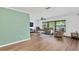 Bright, open living room with wood floors, ceiling fan, and lots of natural light at 1710 Orange Hill Way, Brandon, FL 33510