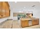 Living room with sliding glass doors leading to patio, open to kitchen with breakfast bar at 1710 Orange Hill Way, Brandon, FL 33510