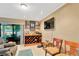 Living room with a bar area and sliding glass doors leading to an outdoor space at 1710 Orange Hill Way, Brandon, FL 33510