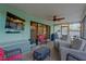 Relaxing screened in porch with outdoor furniture and a wall-mounted television at 1710 Orange Hill Way, Brandon, FL 33510