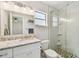 Renovated bathroom with granite countertop, modern fixtures, and tiled shower at 1751 Sutton Pl, Dunedin, FL 34698