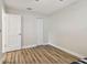 This bedroom features wood-look floors and neutral colors at 1751 Sutton Pl, Dunedin, FL 34698