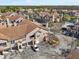 Aerial view of townhomes surrounded by parking and lush landscaping at 17978 Villa Creek Dr, Tampa, FL 33647