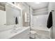 Bathroom featuring a shower-tub combo, white vanity, and gray walls at 17978 Villa Creek Dr, Tampa, FL 33647