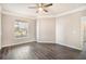 Bedroom with wood floors, window and doorway at 17978 Villa Creek Dr, Tampa, FL 33647