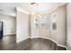 Cozy dining area with hardwood floors, a chandelier, and natural light from large windows at 17978 Villa Creek Dr, Tampa, FL 33647