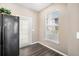 Kitchenette area featuring hardwood floors, and a door to the outside at 17978 Villa Creek Dr, Tampa, FL 33647
