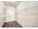 Walk-in closet featuring wood floors and wire shelving at 17978 Villa Creek Dr, Tampa, FL 33647