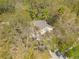 Aerial view of property surrounded by mature trees providing privacy at 2081 Backwater Trl, Palm Harbor, FL 34685