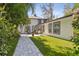 Backyard with pavers, green turf, and seating area, perfect for relaxing and entertaining at 222 11Th N Ave, St Petersburg, FL 33701