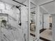 Modern bathroom featuring a walk-in shower with black matte fixtures and white marble-style tile at 222 11Th N Ave, St Petersburg, FL 33701