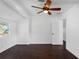 Bedroom with wood floors features natural light and modern ceiling fan at 222 11Th N Ave, St Petersburg, FL 33701