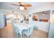 Inviting dining room with a decorative ceiling fan and an open view to the kitchen and living areas at 2246 Sequoia Dr, Clearwater, FL 33763