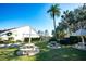 Lush green lawn features picnic tables and a charming gazebo, perfect for outdoor gatherings at 2246 Sequoia Dr, Clearwater, FL 33763